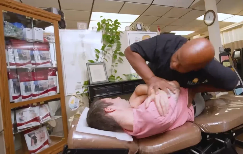 Treatment area at Bell Chiropractic with an adjusting table and wellness products