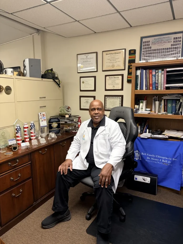 Dr. Henry J. Bell Jr. seated in his office