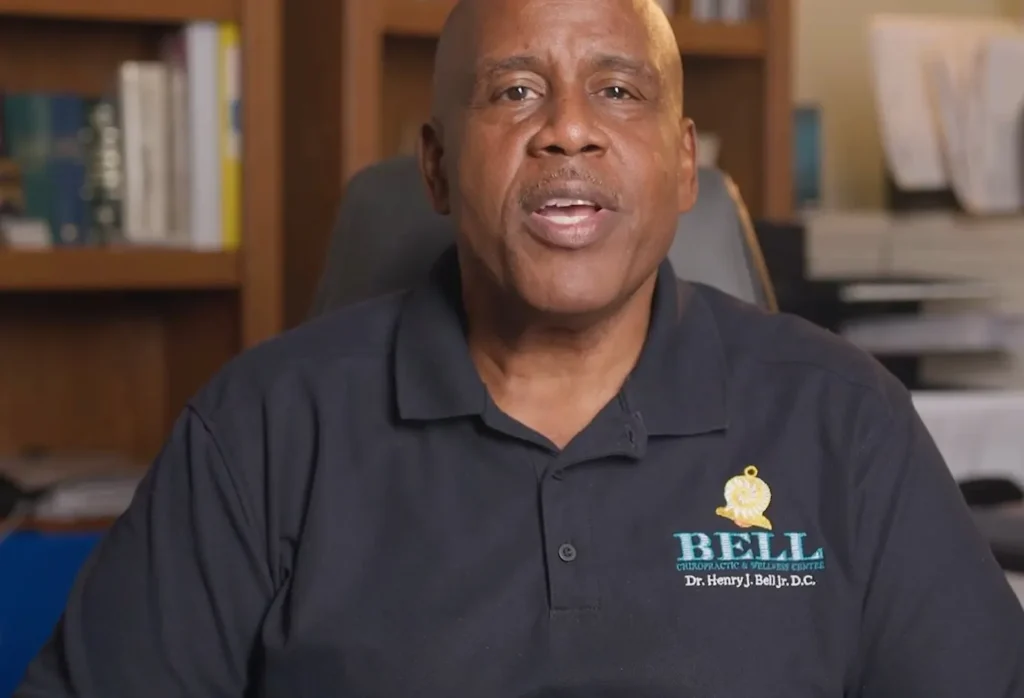 Dr. Henry J. Bell Jr., DC in his office