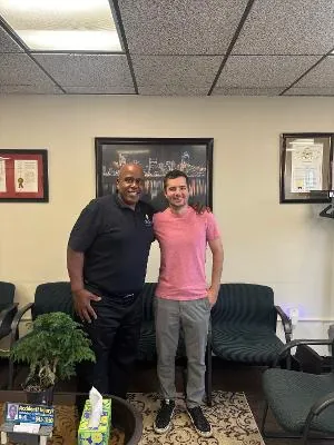 Dr. Henry Bell with a patient at Bell Chiropractic & Wellness Center