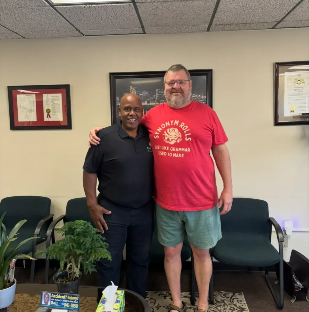 Dr. Henry Bell with a patient at Bell Chiropractic & Wellness Center