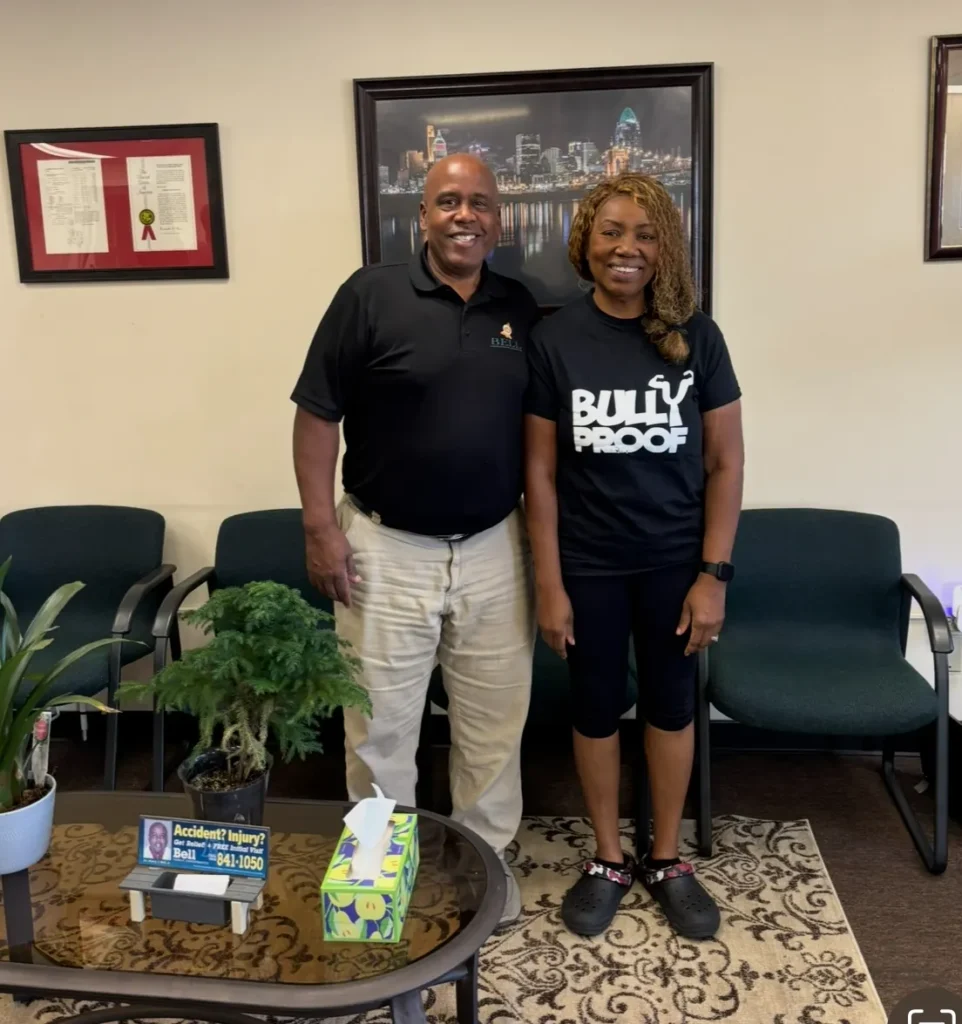 Dr. Henry Bell with a patient at Bell Chiropractic & Wellness Center