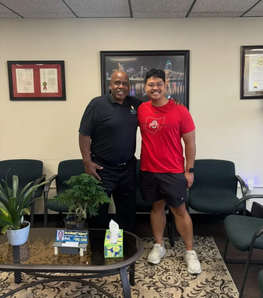 Dr. Henry Bell with a patient at Bell Chiropractic & Wellness Center